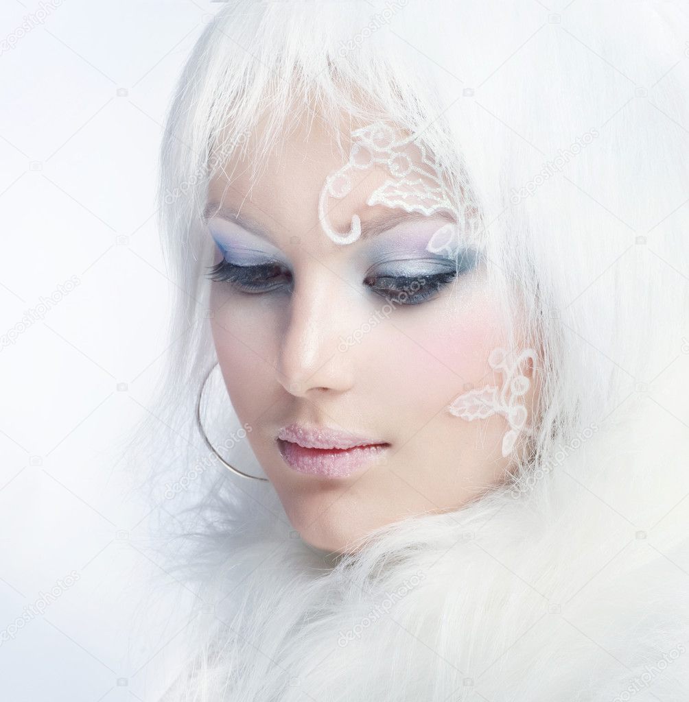 Beautiful Girl's Face. Creative Winter Makeup