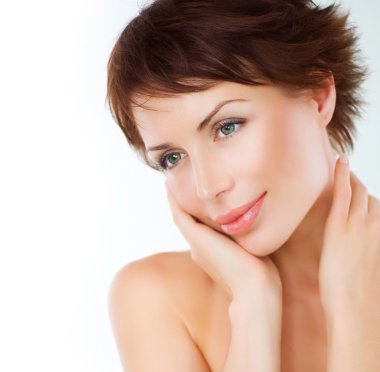 Beautiful Young Woman touching her Face. Skincare .Perfect Skin clipart