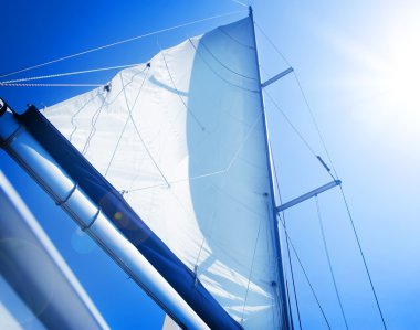 Sails over blue Sky. Yachting concept.Sailboat clipart