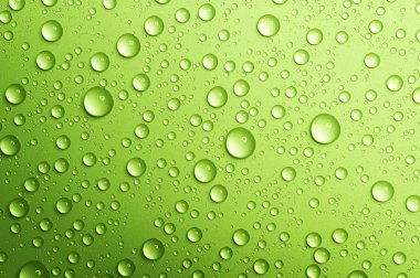 Water drops over green. Closeup