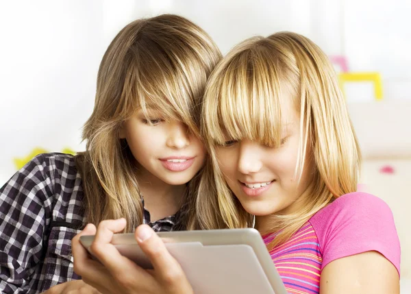 Teenage girls using touchpad. PC tablet — Zdjęcie stockowe