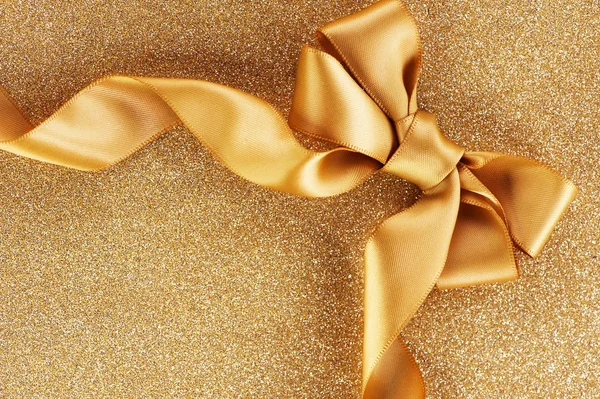 Urlaub background.greeting card.gold bow auf einem blinkenden backgrou — Stockfoto