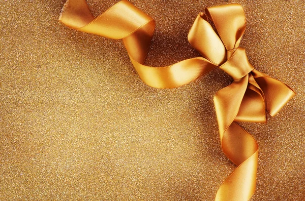 Holiday Background.Greeting Card.Gold Bow on a Blinking Backgrou — Stock Photo, Image