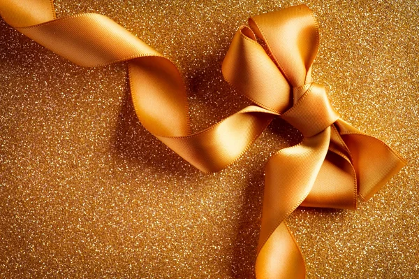 Holiday Background.Greeting Card.Gold Bow on a Blinking Backgrou — Stock Photo, Image