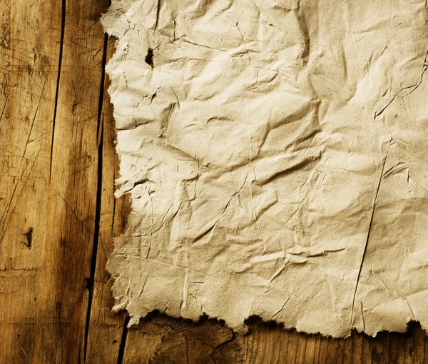 Eski kağıt levha ahşap arka plan üzerinde — Stok fotoğraf