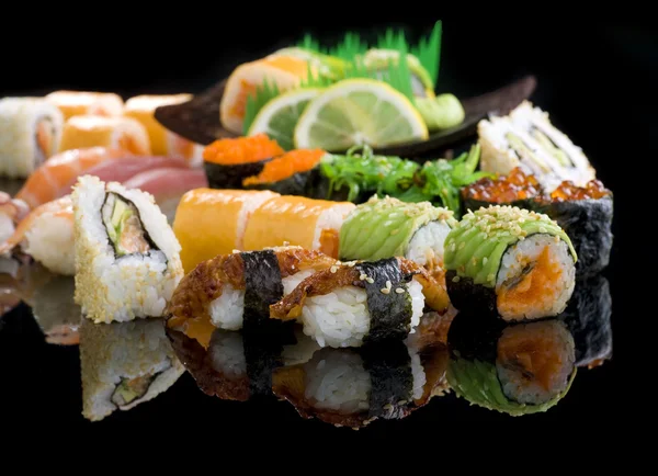 Sushi over black — 图库照片