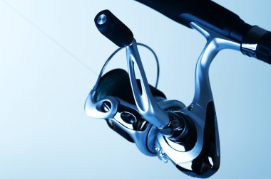 Fishing Reel. Spinning Detail. Selective Focus clipart