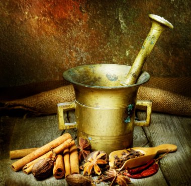 Spices And Antique Mortar With Pestle clipart