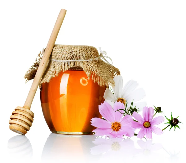 Vaso di miele su bianco — Foto Stock