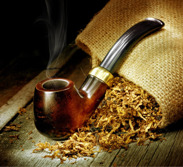 Wooden Pipe And Tobacco Design. Over Black Background
