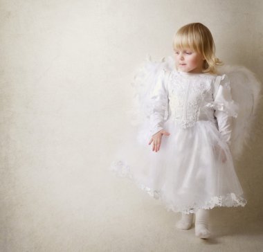 Baby girl in an angel dress clipart