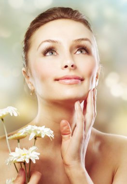 Beautiful Spring Woman With Chamomile Flowers. Healthy Skin. Ski clipart