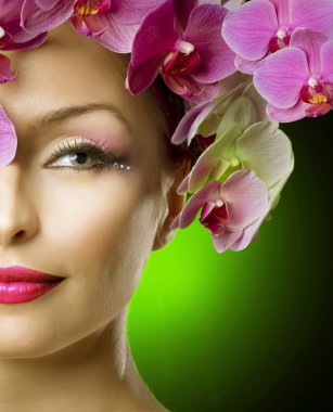 Beautiful Spring Girl With Orchid Flowers Over Black clipart