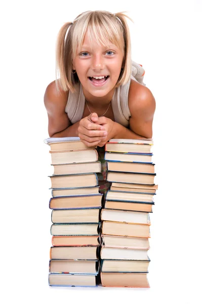 Ritorno al concetto di scuola. Scuola ragazza sopra il mucchio di libri — Foto Stock