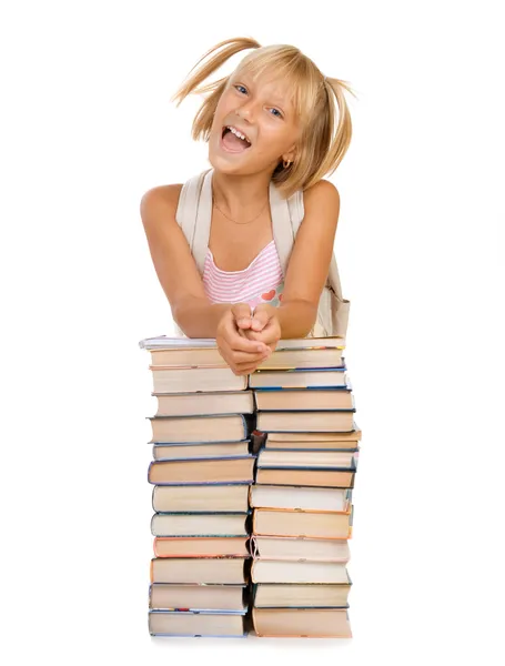 Zurück zum Schulkonzept. Schulmädchen über dem Bücherhaufen — Stockfoto