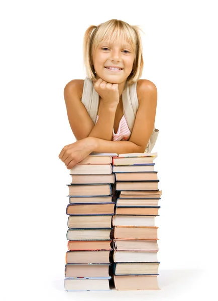 Concepto de regreso a la escuela. Chica de la escuela por encima del montón de libros —  Fotos de Stock