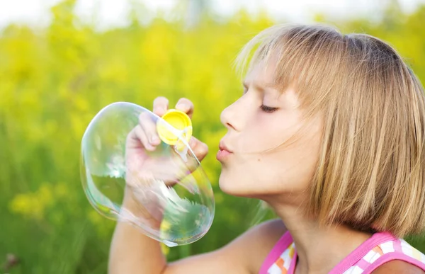 Little Girl Blowing Soap Bubbles — Stock Photo, Image