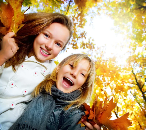 Beautiful Teenage Girls Having Fun in Autumn Park. Outdoor — стоковое фото