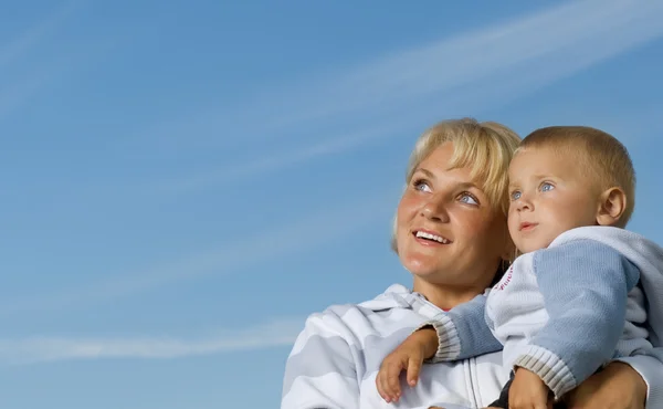 stock image Happy Mother And Baby Outdoor. Over Clear Blue Sky