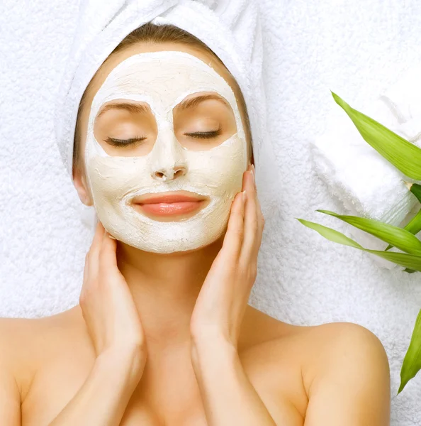 Spa Woman applying Facial clay Mask. Beauty Treatments Royalty Free Stock Photos