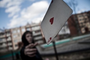 Man throws a card in the direction of the photographer clipart