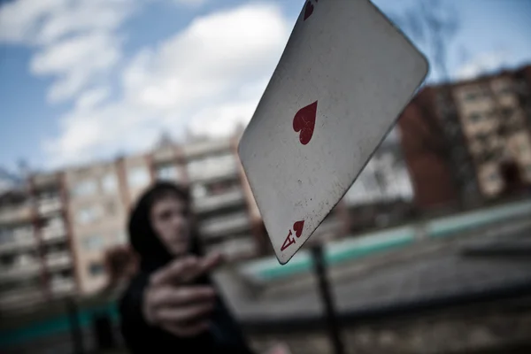 stock image Man throws a card in the direction of the photographer