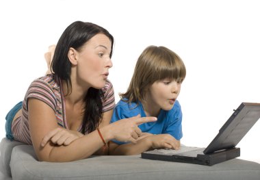 Mother and son are using laptop clipart