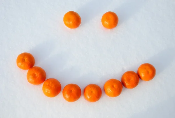 stock image Smile, composed of oranges in the snow