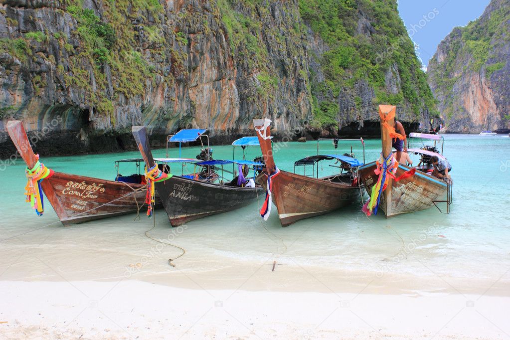 Longtail boats on tropical beach