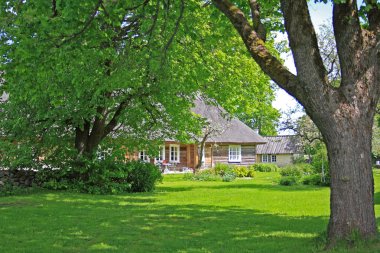 Old farmhouse and idyllic courtyard, Estonia clipart