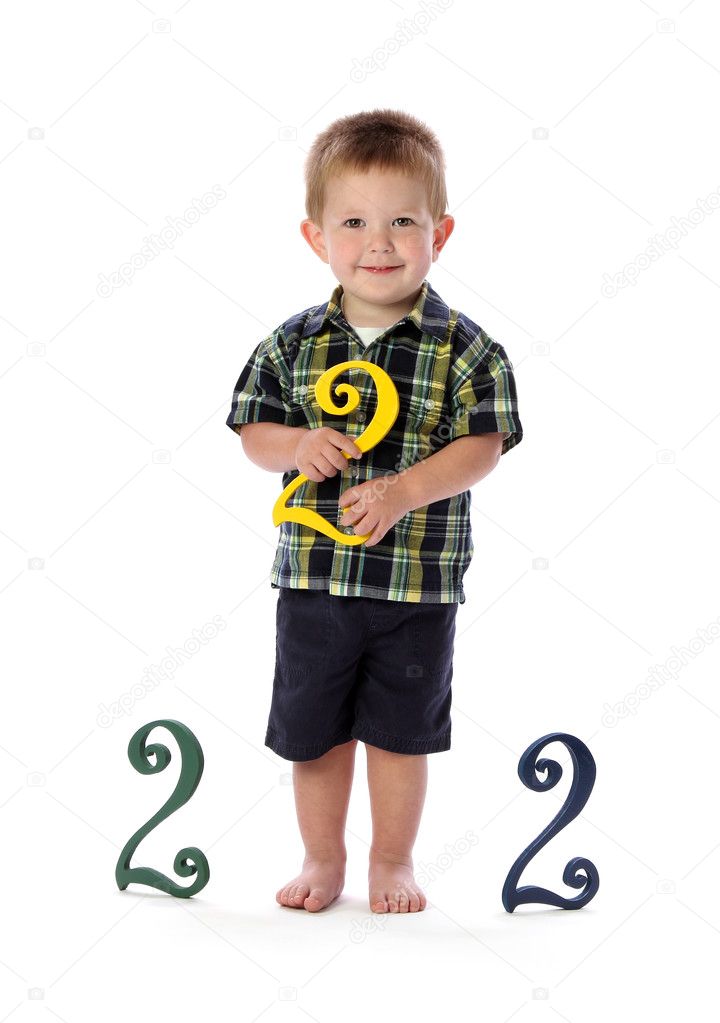 A Two Year Old Holds a Number Two