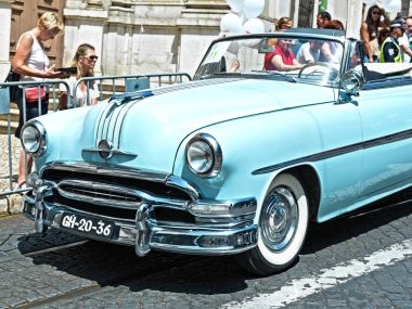 Car vintage blue in street clipart