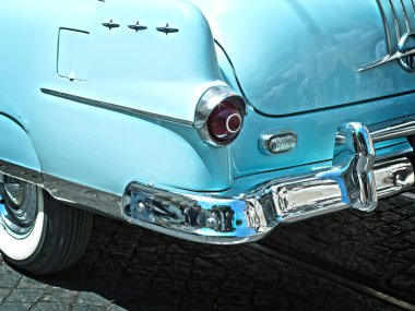 Rear view of a vintage car fin closeup. blue clipart