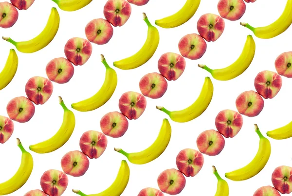 Bananer och persikor bakgrund — Stockfoto