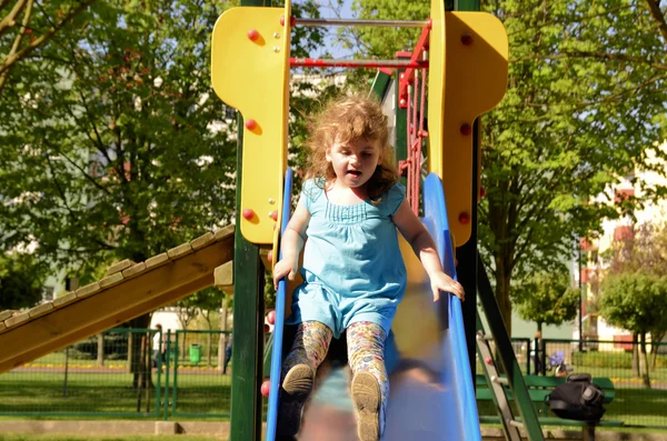 stock image Little girl on the slide