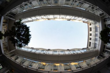 View the sky from the courtyard of the building clipart