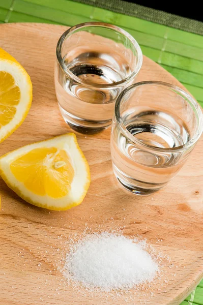 Tequila mit Salz und Zitrone Stockbild