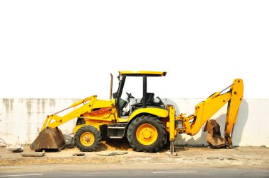 Wheel loader machine on the road clipart