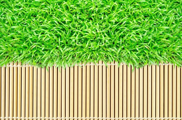Grasrahmen auf Bambus Textur Hintergrund — Stockfoto