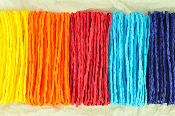 Colorful ropes on Tissue paper — Stock Photo, Image