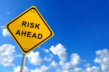 Risk ahead traffic sign on bluesky clipart