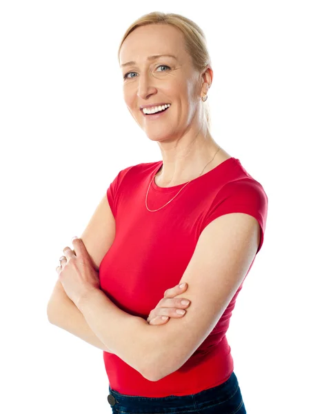 Smiling middle aged lady, poisng with folded arms — Stock Photo, Image