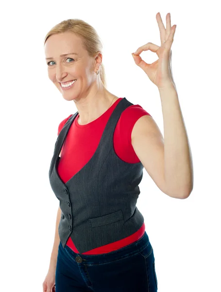 Confident pretty woman gesturing excellent — Stock Photo, Image