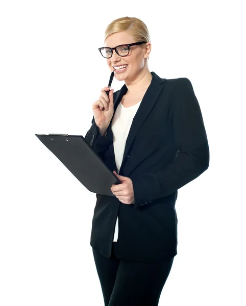 Smiling mischievous female business executive — Stock Photo, Image