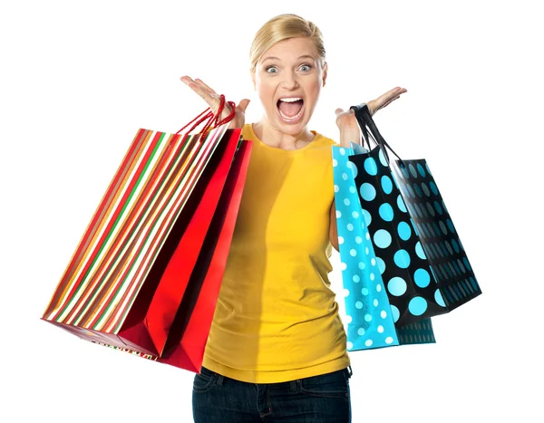 Young woman excited after tons of shopping — Stock Photo, Image