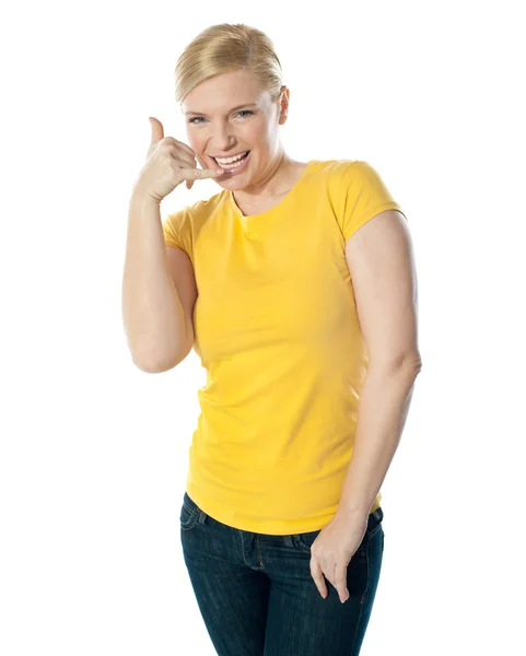 Attractive girl showing calling gesture — Stock Photo, Image