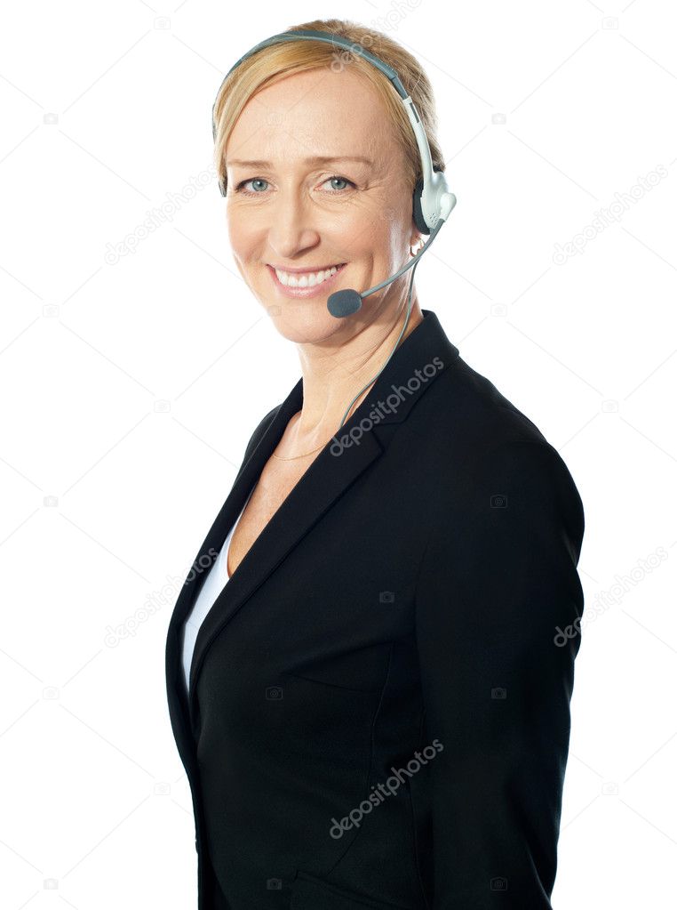 Aged female call centre excutive posing with headsets