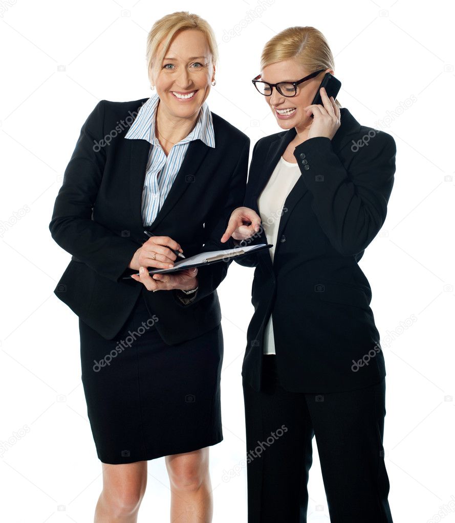 Businesswomen on call rectifying the document
