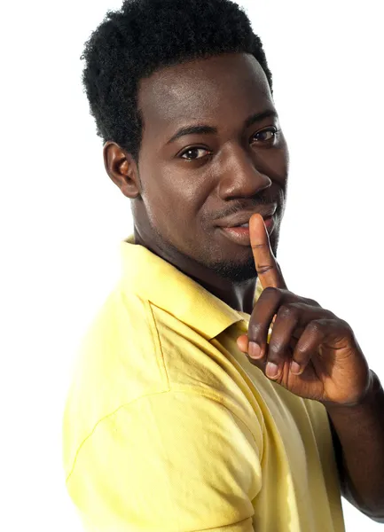 Handsome young guy gesturing silence — Stock Photo, Image