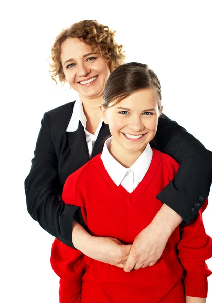 Teacher embracing her student from back — Stock Photo, Image